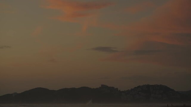 Golden Sunset on Beach with Waves and Sun Reflection