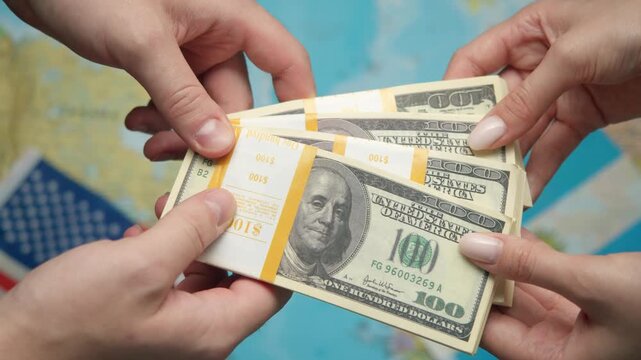 American economist passes stack of dollars to Argentine representative against world map with US and Argentine flags for agricultural partnership.