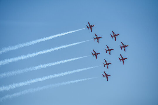 A group of aerobatic jet aircraft flying in perfect formation du