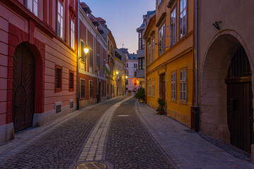 Fototapeta premium Sunrise view of a narrow street in Sopron, Hungary