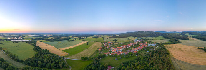 Sunset panorama view of traditional south Bohemian village Holas © dudlajzov