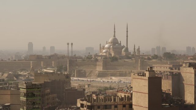 View of Saladin Citadel with Muhammad Ali Mosque on Muqattam Hill in cityscape of Cairo Egypt