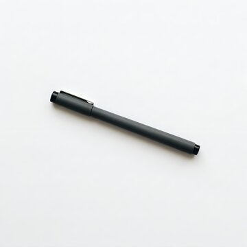Black technical pen with cap closed isolated on white background minimal flat lay