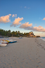 Fototapeta premium Varadero, Cuba; 04.07.2023. Beautiful, colourful sunset on the beach in Varadero, Cuba! Cote d'Azur of the Atlantic Ocean, next to the Caribbean Sea. Cuba wild palm beach background. Nature blue sea l