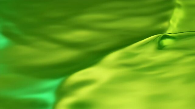Abstract green, yellow, and chartreuse hues blend, suggesting a natural, undulating surface