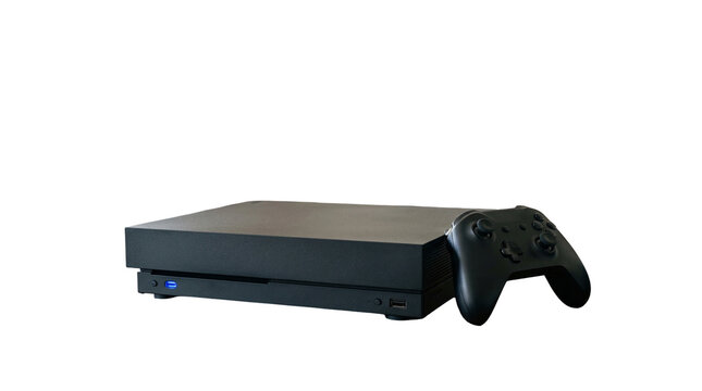 Black playstation console with controller on white background