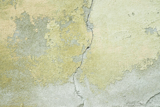 Textured cracked yellow wall background