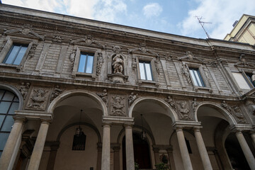 Ornate stone arcade facade detail in Milan, Italy © Joseph Creamer
