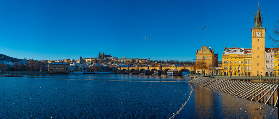 Panorama of Prague dominated by the Prague castle in winter, Cze © dudlajzov