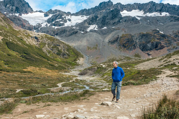 Fototapeta premium Man hiking and exploring the steep snowy trails of Martial Glacier in Ushuaia Patagonia Argentina