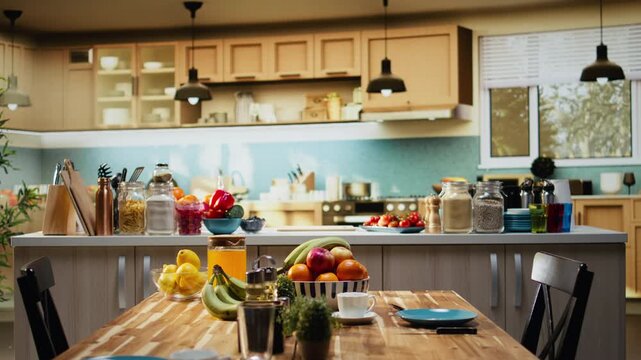 Empty home kitchen studio used for filming a food vlog with meal prep and ingredients at the counter, recording a recipe and health eating inspiration with camera and tripod. Cooking show.