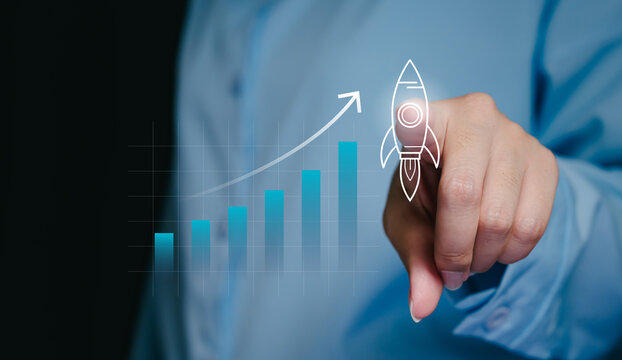 Startup launch concept, hand pointing rocket icon with rising graph, business acceleration and innovation growth, success strategy, investment planning, digital transformation, future expansion