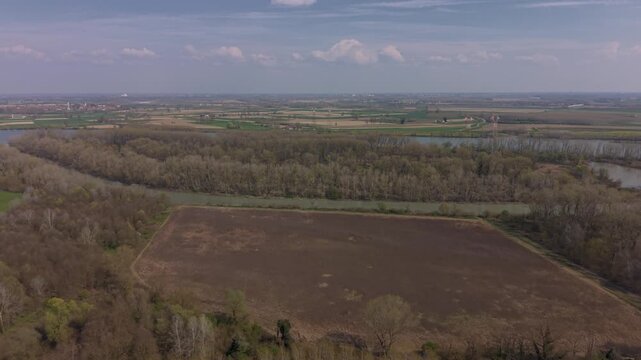 Aerial Perspective: Verdant Valley Amidst the Whispers of the Winds. An elevated vista showcases a verdant valley. Emilia Romagna, Piacenza