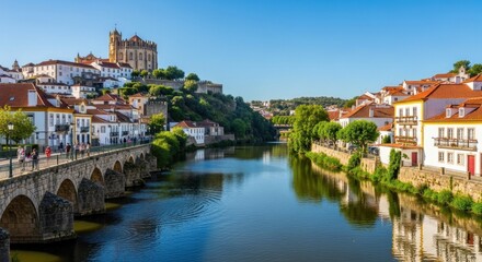 Fototapeta premium Picturesque view of Mirandela, Portugal, with bridge and historic buildings.