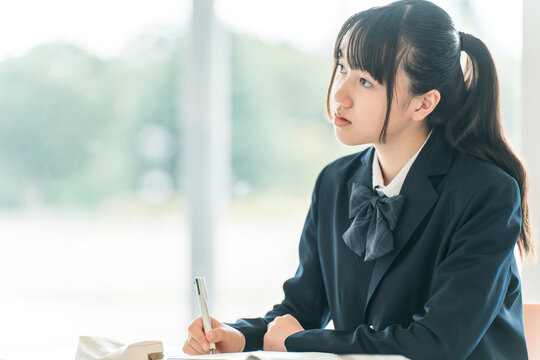 High school, middle school, and elementary school girls taking exams and tests in school classrooms or cram schools (for entrance exams)