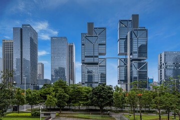 Fototapeta premium Aerial view of DJI Sky City skyscrapers and modern office buildings in Shenzhen, China on a clear day.