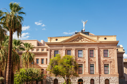 Historic Arizona State Capitol building with a prominent copper dome and the "Winged Victory" statue located in downtown Phoenix, Arizona
