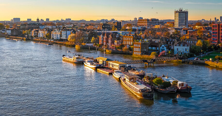 Houseboats Moored on River Thames in Hammersmith London Waterfront Scene