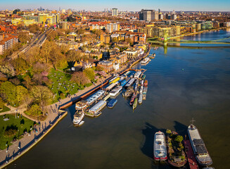 Hammersmith Bridge Over River Thames with London Skyline in Golden Light