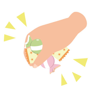 お菓子のつかみ取りをする子供の手