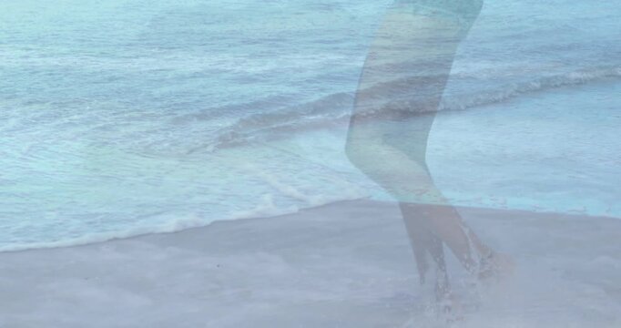 Vertical video: Woman shifting weight stepping through surf causing echo overlay selling swimwear