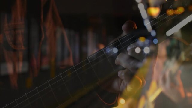 Vertical video: Guitarist playing music on metro while train light coming, merging fret with lights