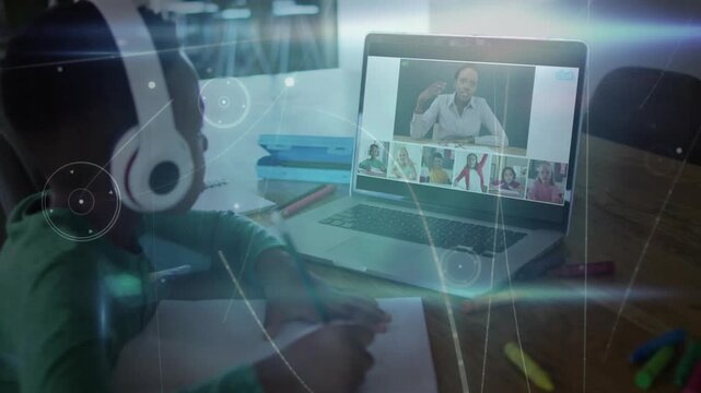 Girl wearing headset writing in notebook as online teacher gesturing cueing remote lesson, overlays