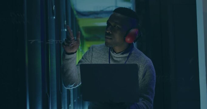 Datacenter technician checking laptop, pointing rack, locating faulty bay, diagnostics overlaying