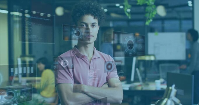 Man in pink polo arms-crossed in tech office, AR icons and code fading in, smiling confidently