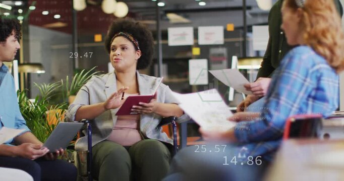 Woman in wheelchair tapping red tablet and presenting business data while hex icons showing charts