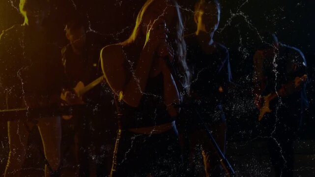 Pullback triggers female singer stepping center, singing into mic for music duet amid film-scratch