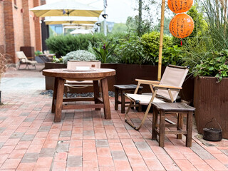Fototapeta premium Charming Outdoor Space with Cozy Furniture for Relaxation and Gatherings
