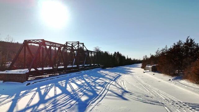 The Historic Canadian National Railway Swing Bridge Over Trent Severn Waterway in Frankford Ontario Canada, Low Angle Aerial Drone Shot.