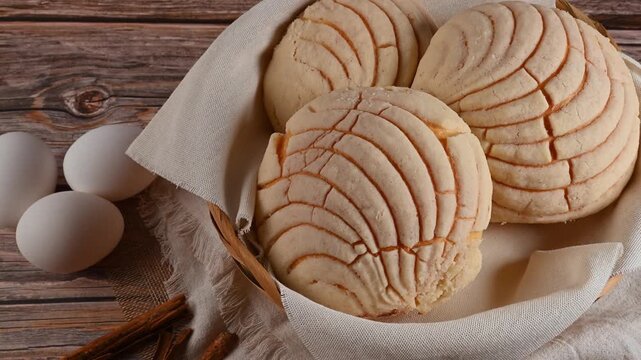 Close-up of sweet Mexican bread rolls with shell-like pattern, Mexican conchas