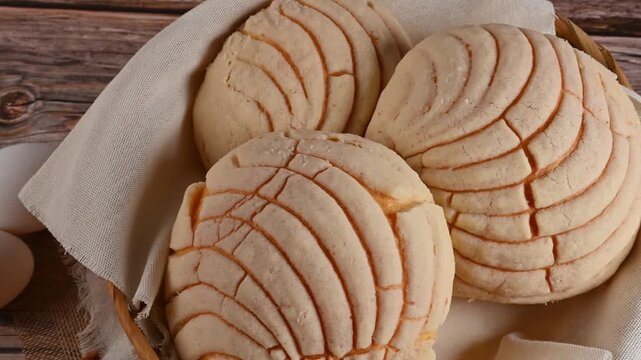 High angle view of artisanal Mexican sweet bread with sugar crust, Mexican conchas