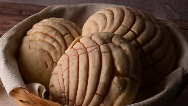 Low key video, macro view of traditional Mexican vanilla conchas