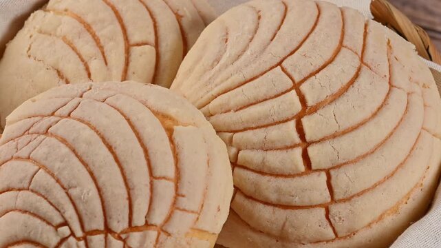 Mexican bakery concept, vanilla conchas on a cloth napkin