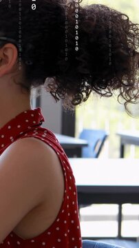 Vertical video: Student turning head near window starting binary overlay showing edtech on glasses