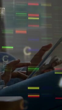 Vertical video: User tapping tablet, causing tech bars and GCT glyphs stacking over hands browsing