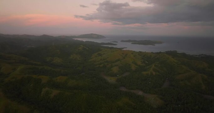 Islands with mountains and paddy fields at dusk time. Santa Fe, Tablas, Romblon. Philippines.