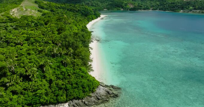 Coastline with white sand beach and turquoise clear water. Romblon, Romblon. Philippines.