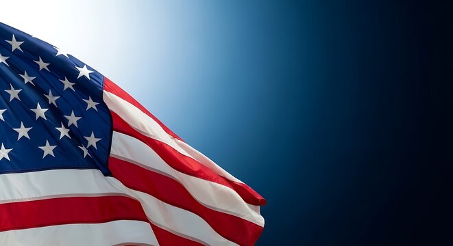A close up view of the american flag waving against a dark blue background for national holidays