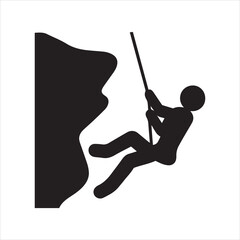 Silhouette of a rock climber rappelling down a cliff face with rope © Bissowjid