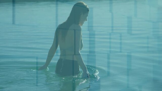 Woman wading ahead in shallow sea, stepping deeper and making ripples while grid overlaying for art