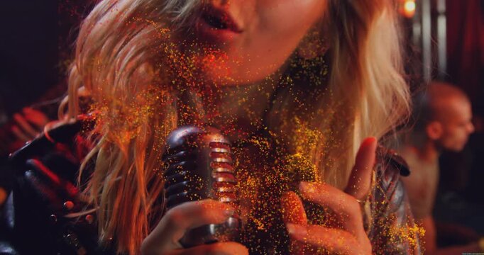 Vocalist gripping mic, singing and starting gold glow swirling across face and hands boosting music