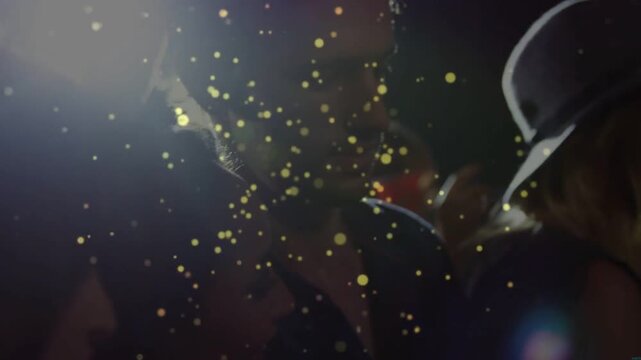 Left event light rising, woman with wide brim hat showing profile smiling as gold confetti drifting