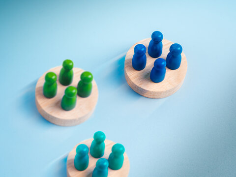 Cross functional team concept with different colored groups on separate platforms. Department collaboration, organizational structure, teamwork, partnership, business competition, stakeholder.