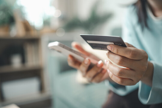 Customer using smartphone and credit card for buy now pay later online payment. Concept of BNPL installment service, digital shopping finance, flexible checkout payment plan, and modern ecommerce.