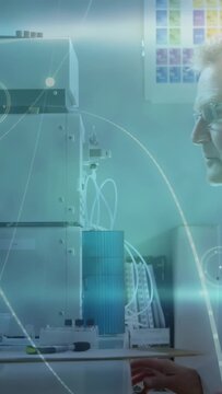 Vertical video: Gloved hand reaching senior tech tuning lab instrument for test while HUD tracking