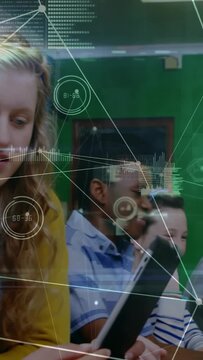 Vertical video: Student adjusting screen, two pupils sharing tablet for class while HUD over tablet